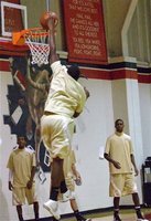 Image: Rim-rocking fun — Larry Mayberry, Jr. joins his Gladiator teammates during a pre-game dunk fest that proved to be a precursor for events to come. With one slam after another, it was like watching circus olay!