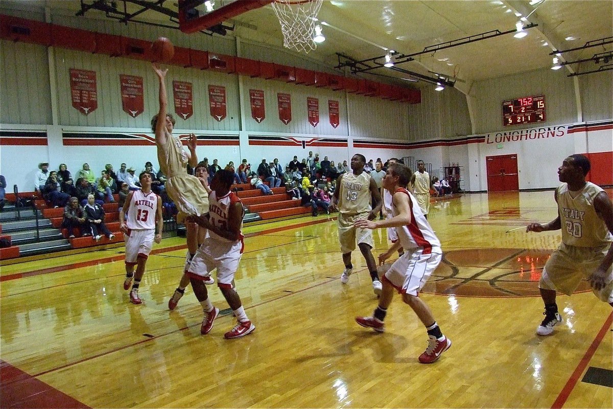 Image: Colton hits from block — Gladiator Colton Campbell(5) finds clear skies over Axtell.