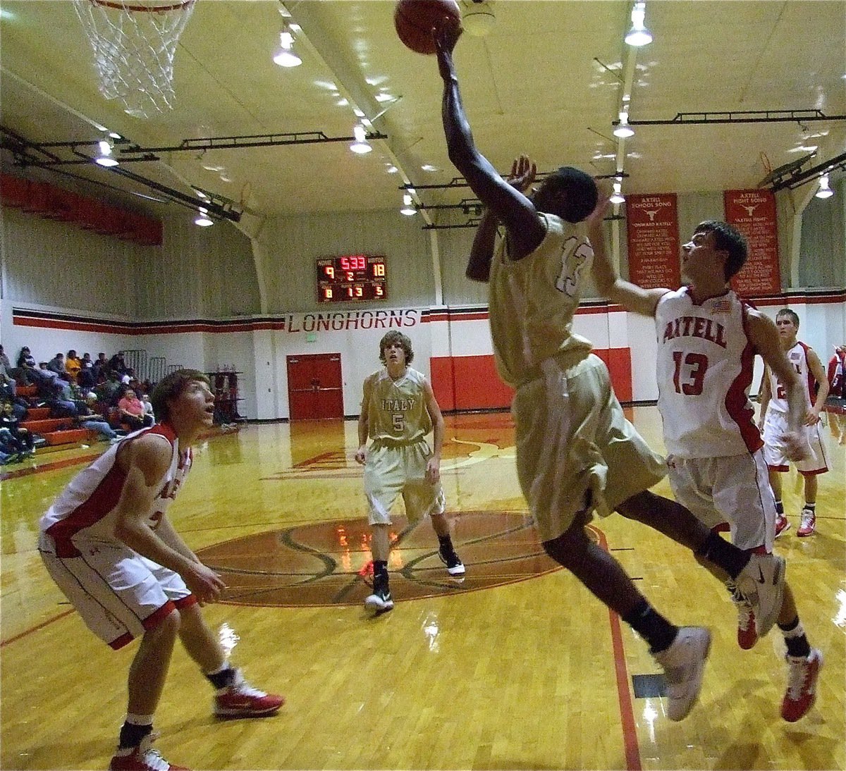 Image: Impressive skills — Larry Mayberry, Jr.(13) maneuvers to score near the paint without using his dribble.