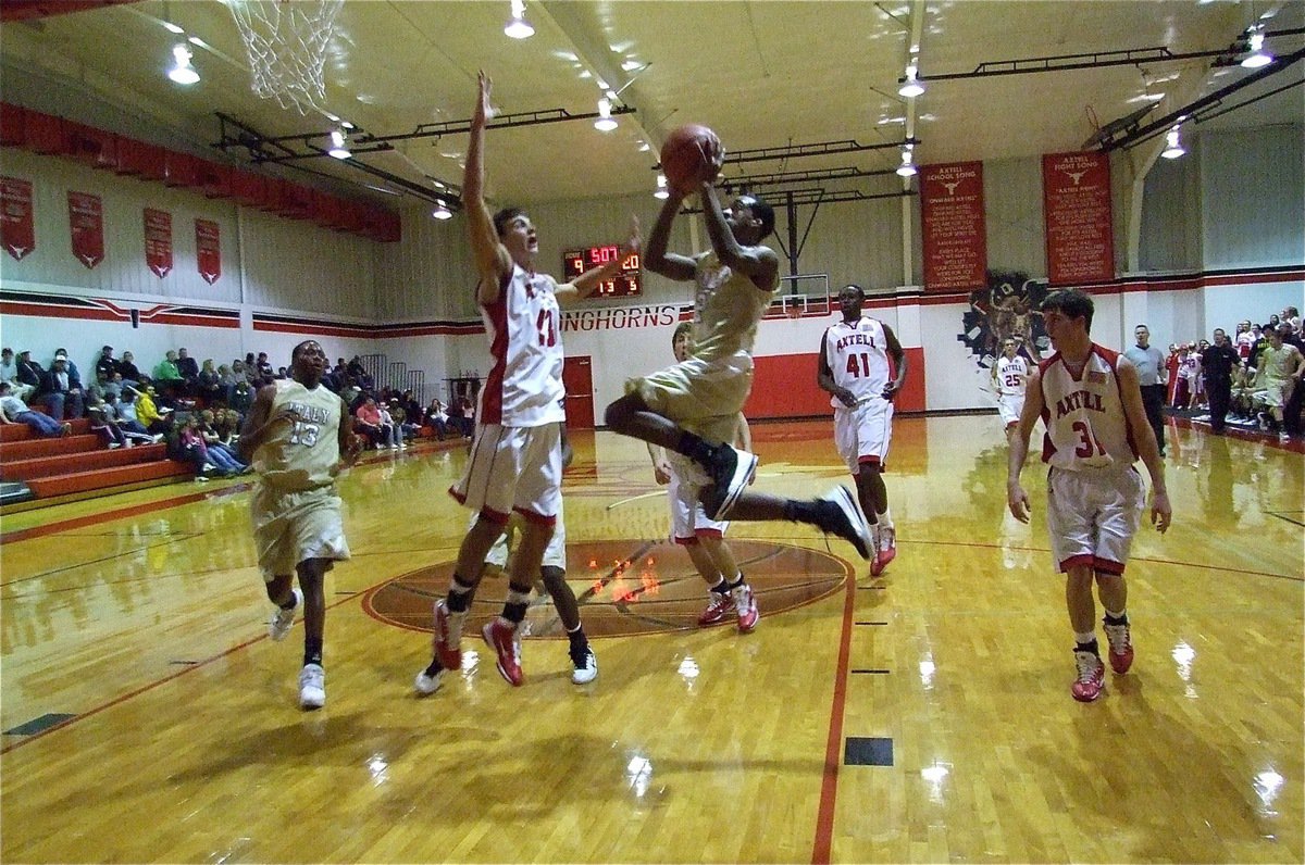 Image: The takeoff — Heath Clemons(2) helps carry the Gladiators to new heights against Axtell.