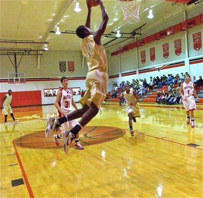 Image: Dunking Devonta — Devonta Simmons(10) steals Axtell’s inbound pass attempt and then dunks in the gift.
