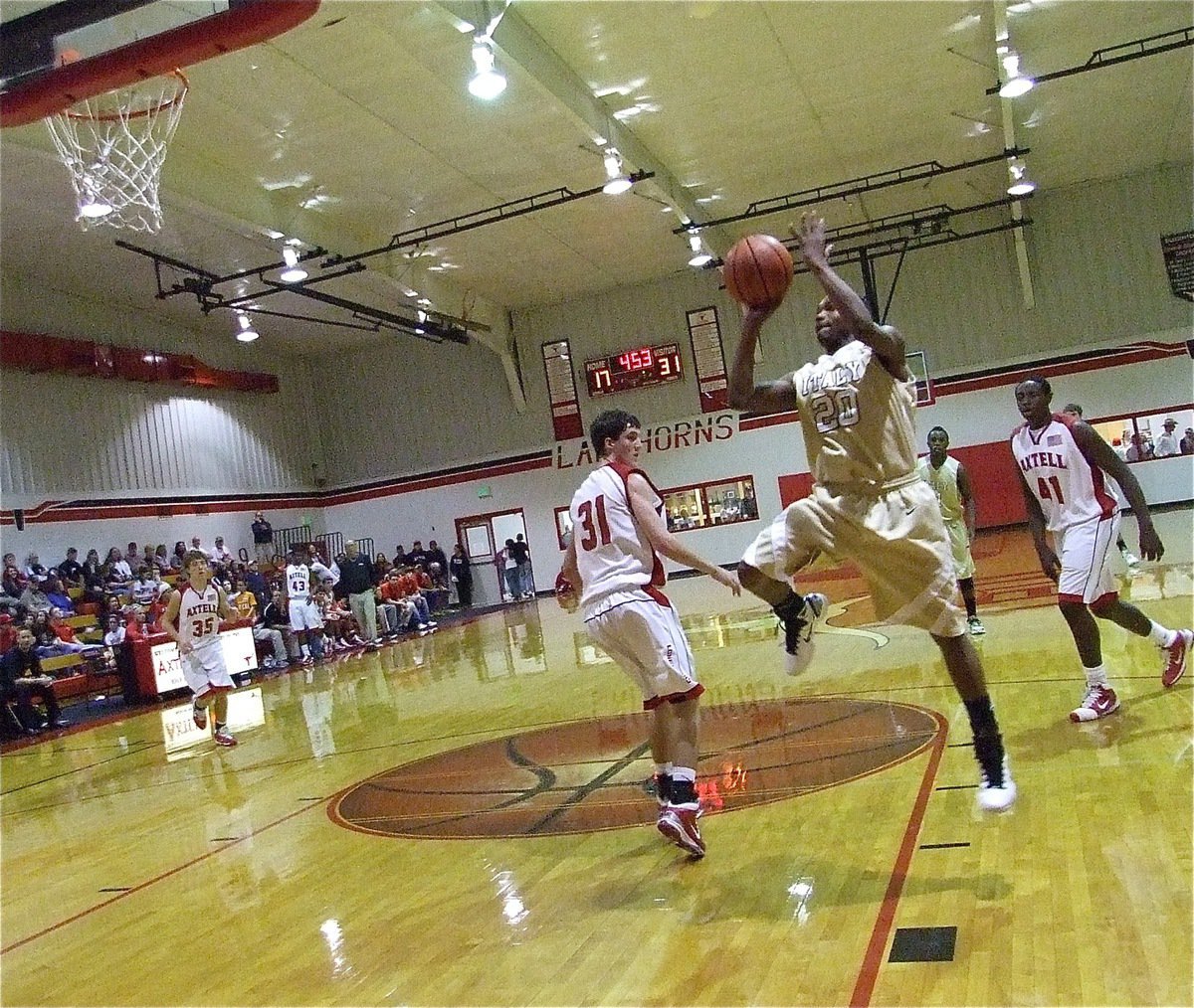 Image: What a play! — Gladiator De’Andre Sephus(20) steals the ball from behind and quickly lays in a score.