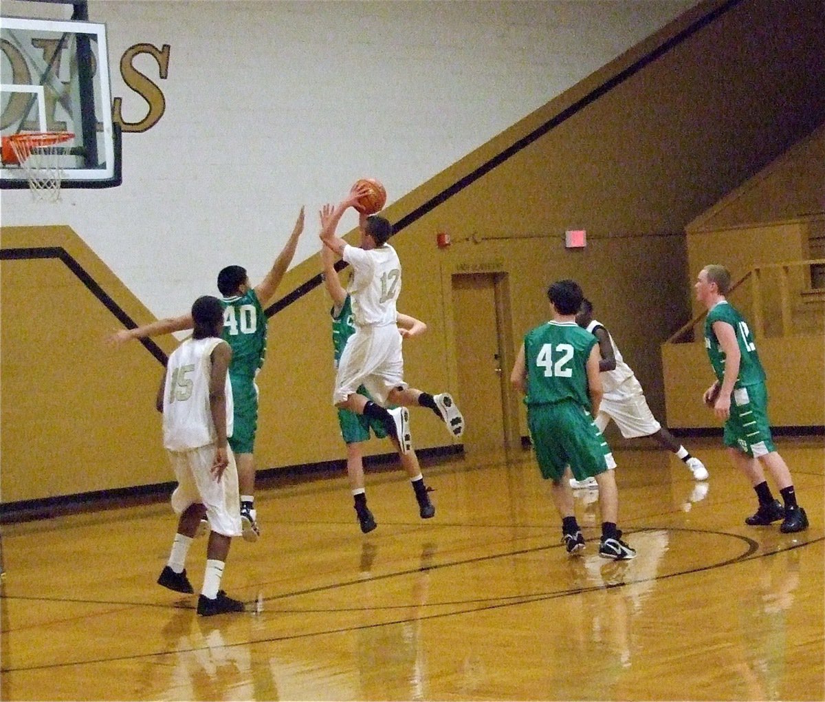 Image: The right moves — Italy JV Gladiator Bubba Itson(12) attacks the Cubs defense for two of his 11-points.