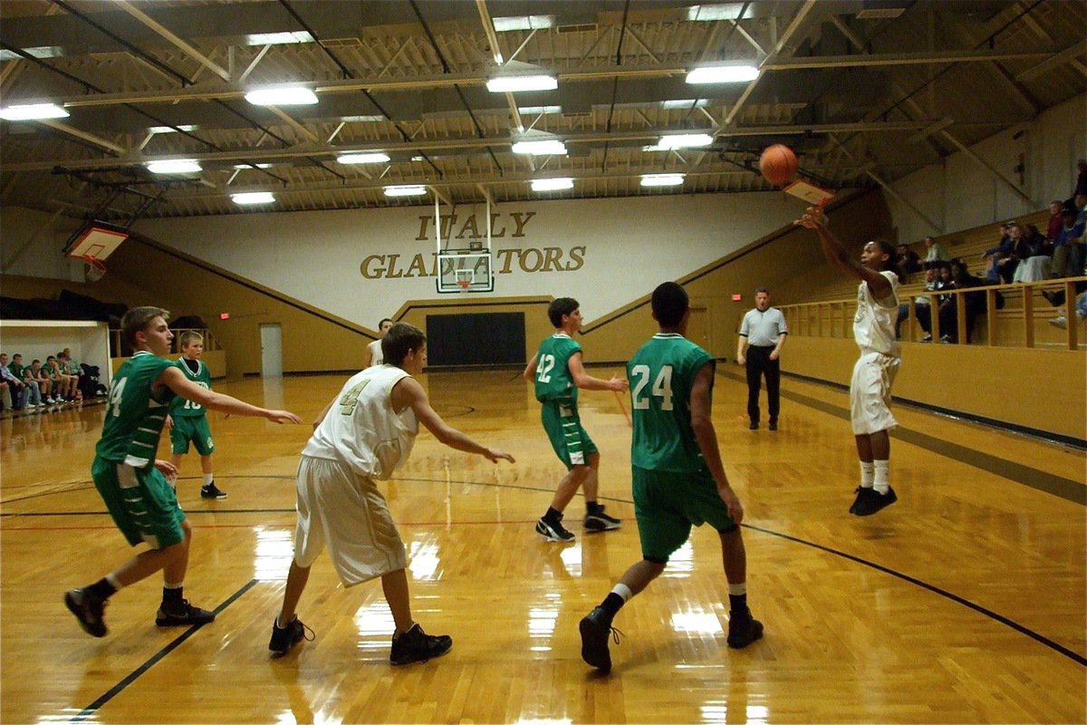 Image: Tre-time — Clifton leaves Trevon Robertson(15) open so the Freshman tries to close the deal for Italy’s JV squad.