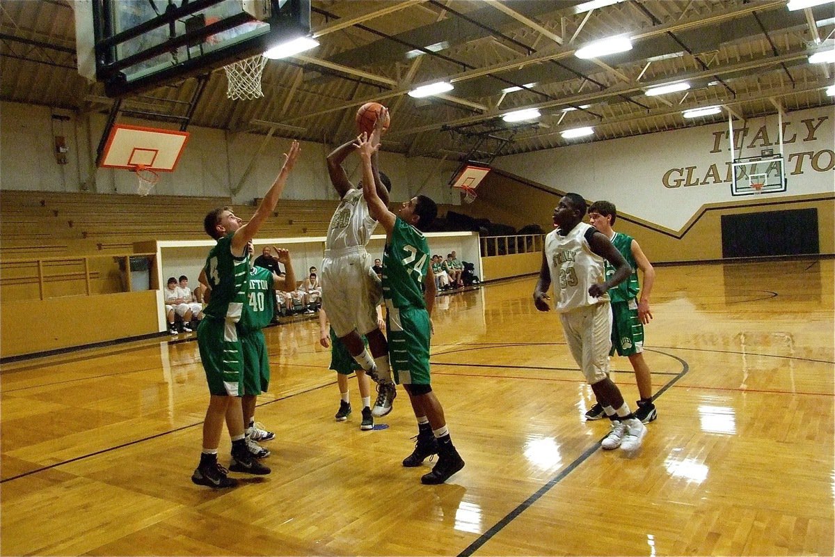 Image: Lewis gets loose inside — Jalarnce Jamal Lewis(30) scores 4-points in the second quarter for Italy’s JV. Gladiators.