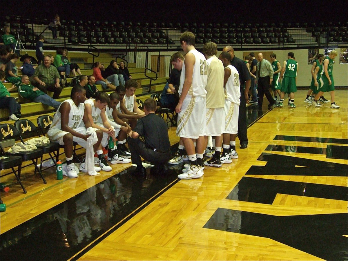 Image: Plan of action — Gladiator head coach Aidan Callahan discusses the battle plan with Larry Mayberry, Jase Holden, Jasenio Anderson, Devonta Simmons and Brandon Souder.