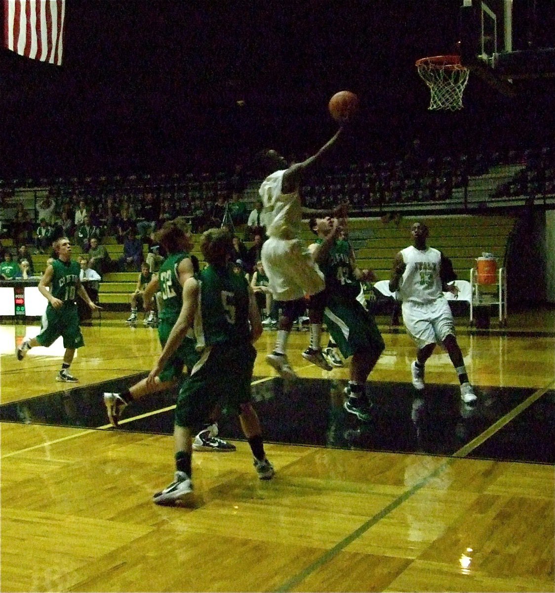 Image: A helping hand — Jasenio Anderson(11) helps take the Gladiator offense to new heights.