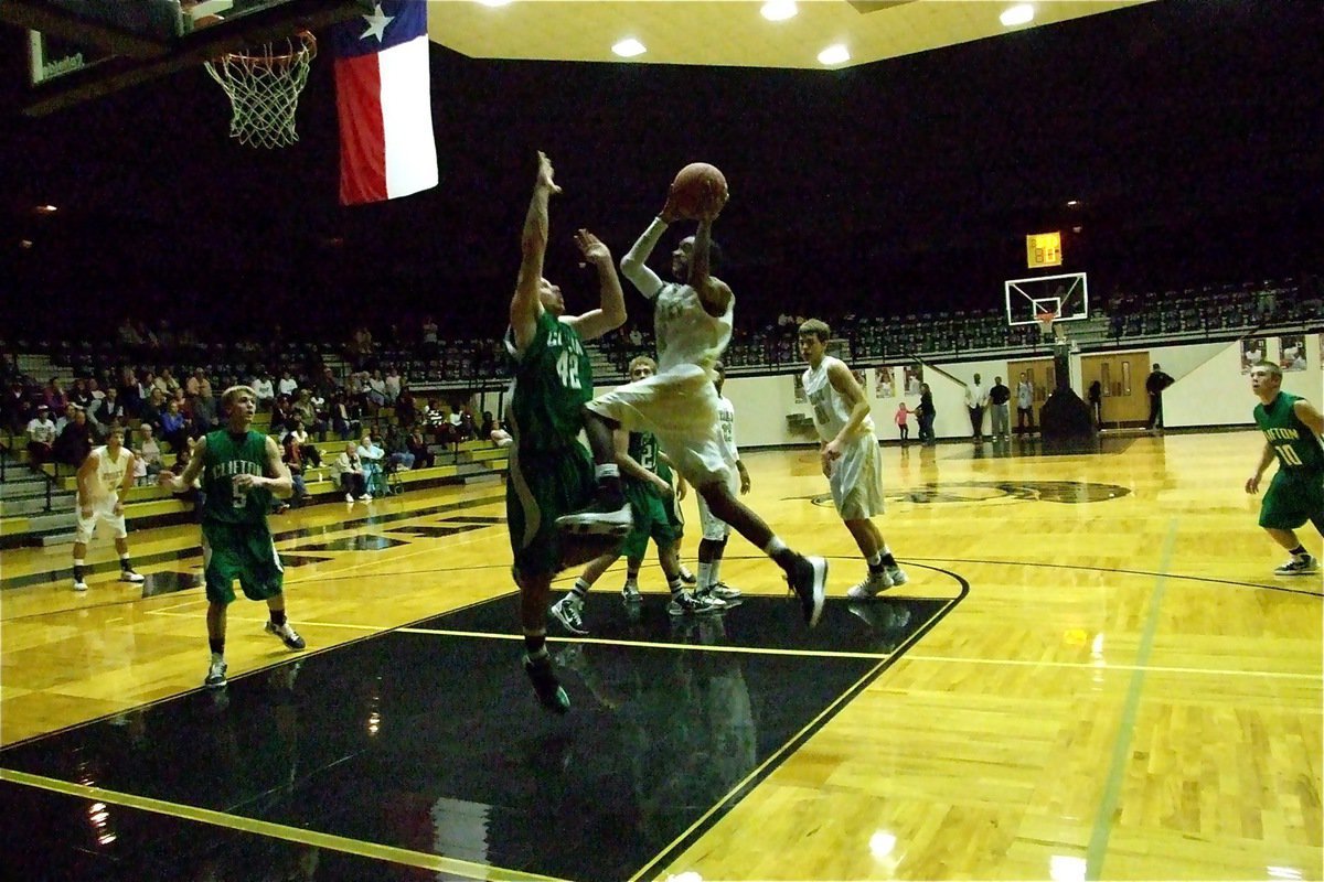 Image: Aerial display — Heath Clemons(2) flies thru the air with the greatest of ease on his way to 2-points.