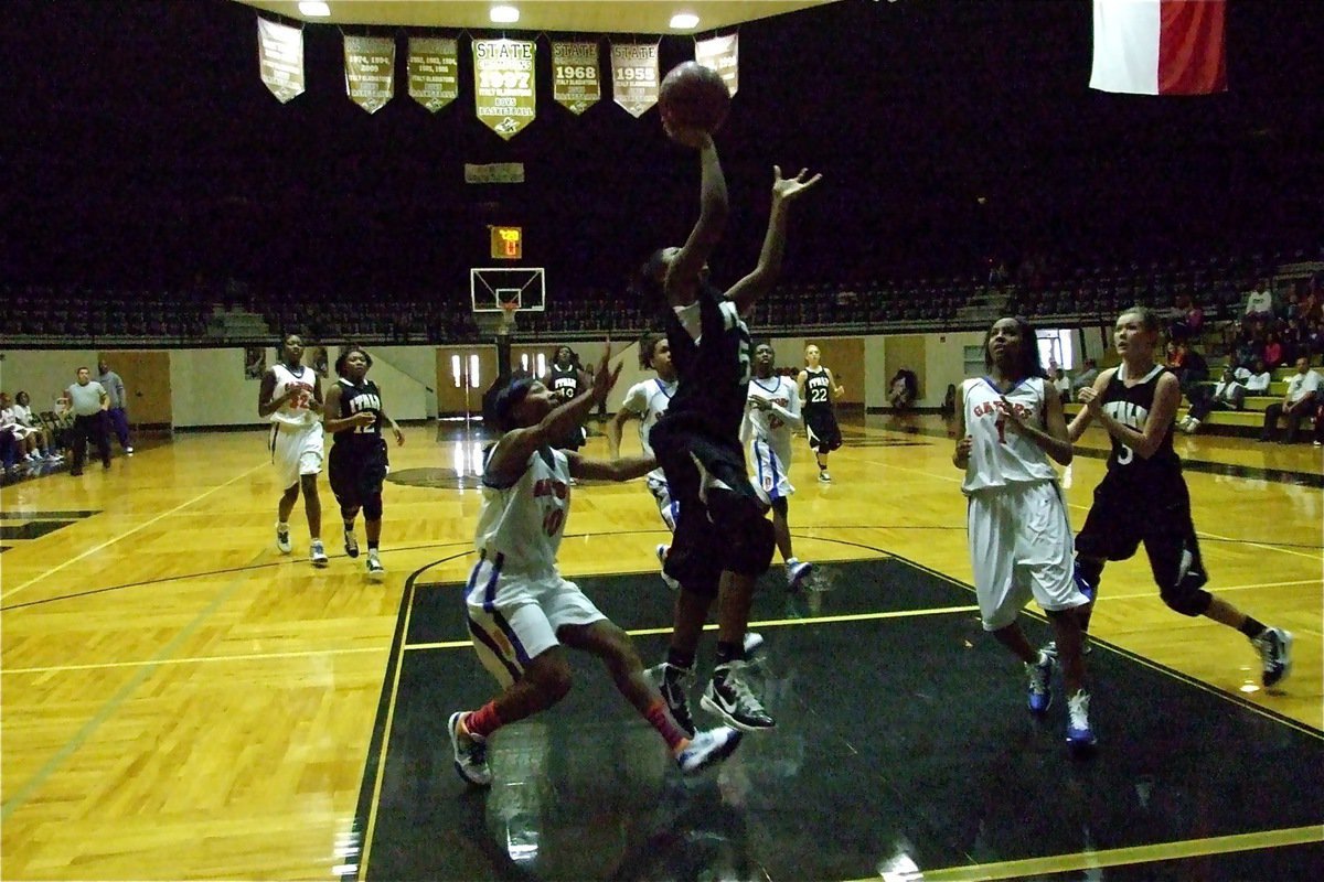 Image: Copeland breaks — Lady Gladiator point guard Jameka Copeland(5) scores inside in the big game.