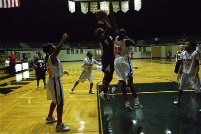 Image: In the post — Lady Gladiator Jimesha Reed(40) tries to release a shot over Gateway’s center.