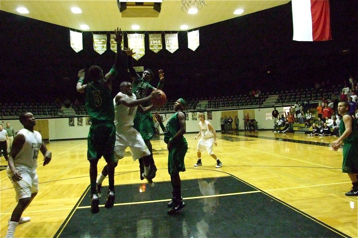 Image: What a shot! — Somehow, Jasenio Anderso(11) finds away to get this shot attempt to fall in during the championship matchup between Italy and Kerens.