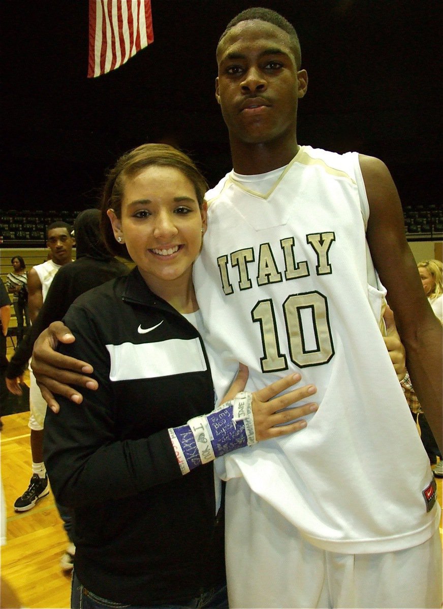 Image: Hug for the hero — Lady Gladiator Alyssa Richards gives Devonta Simmons(10) a congratulatory hug after Simmons put in the buzzer-beating basket to help the Gladiators get an overtime victory, 68-67, over the Kerens Bobcats during the 2010 Italy Invitational Tournament championship game.