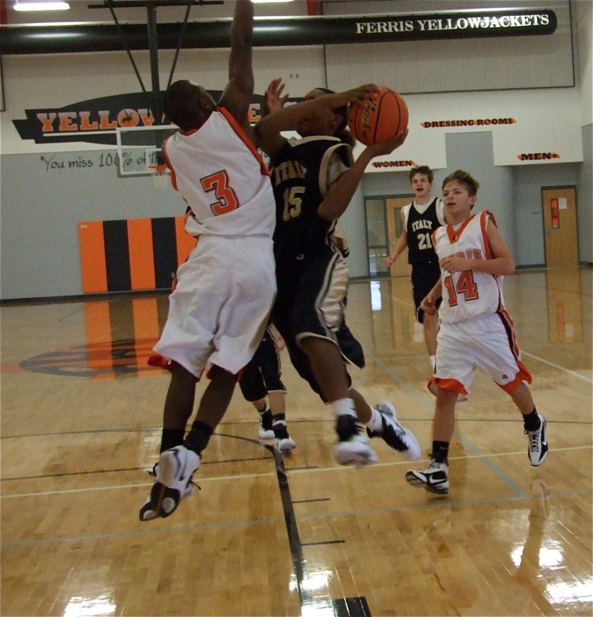 Image: Stinger vs. Sword — Attacking the rim, Trevon Robertson(15) and his JV Gladiator teammates were just too strong for the Ferris freshmen.