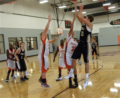 Image: Cole down low — Italy’s Cole Hopkins(21) works the low block against the Ferris freshman team.