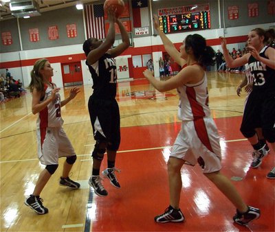 Image: Chante shoots — Chante Birdsong(12) gets inside and puts up a jump shot with teammate Bailey Bumpus available for a pass.