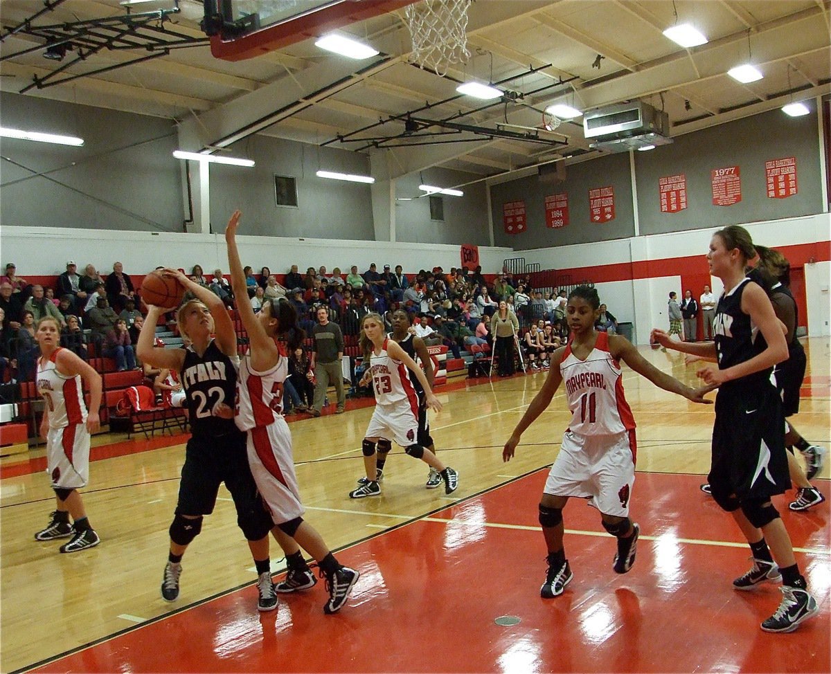 Image: Block battle — Italy’s Megan Richards(22) battles down on the block against Maypearl’s Shelbi Roberson(22).