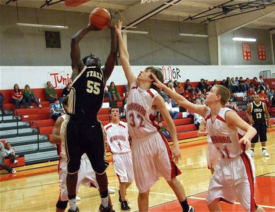 Image: Power in the paint — JV Gladiator Raheem Walker(55) muscles his way to two-points over the Panthers.