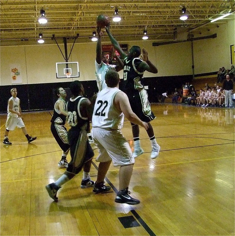 Image: Not in your house! — Travis Cockran(33) blocks a Jaguar jumper.