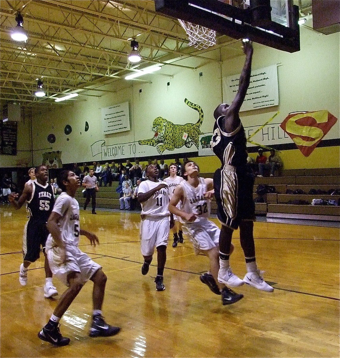 Image: Travis gets two — Travis Cockran(33) beats the Jaguar defense down the floor for a bucket.