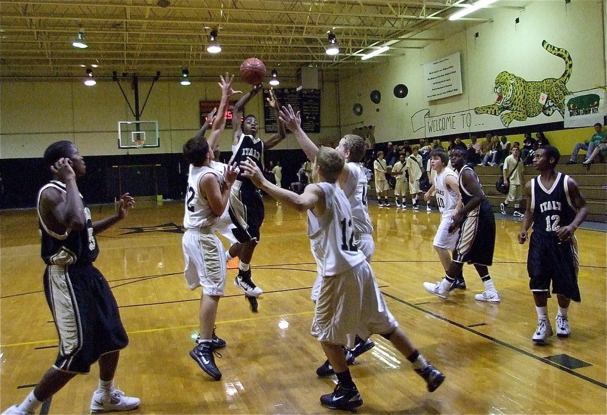 Image: Up and away — JV Gladiator point guard Eric Carson(10) drives the middle.