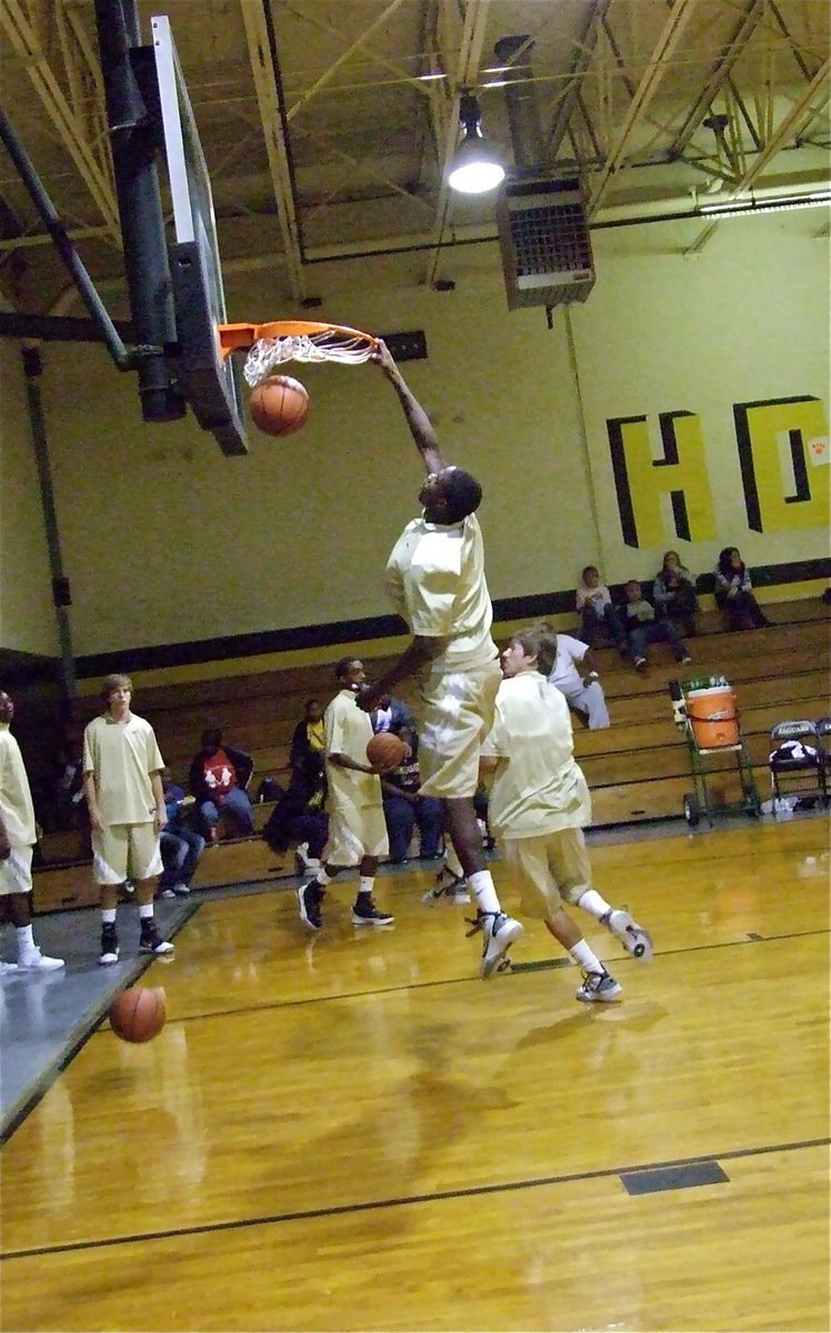 Image: Throw it down! — Varsity Gladiator Devonta Simmons rocks the rim in Hubbard during warm-ups.