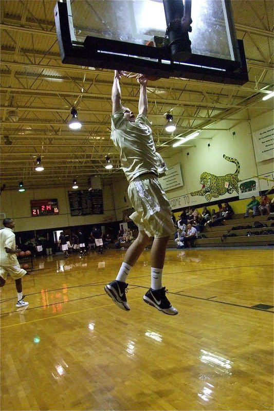 Image: That’s Cole! — Cole Hopkins puts in a two-handed jam before the Varsity game against Hubbard.