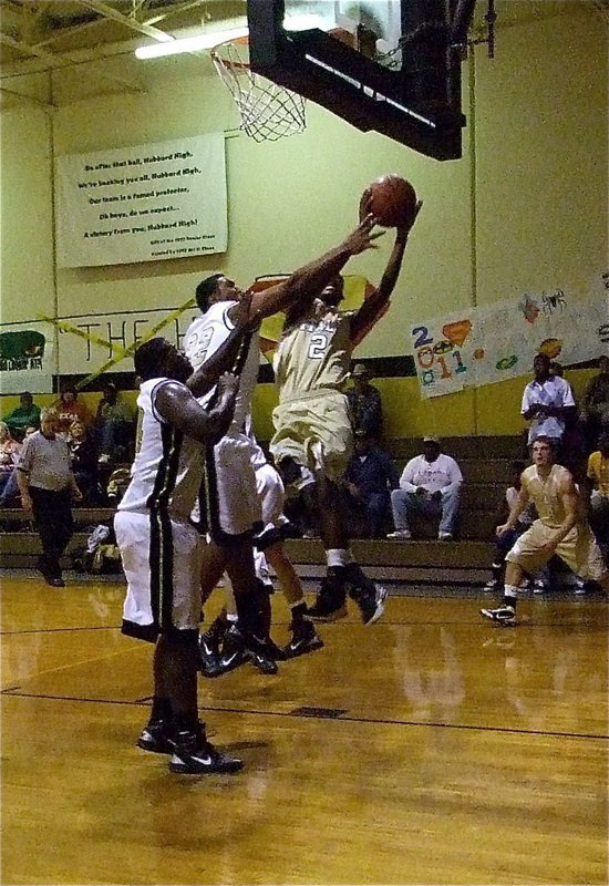 Image: Snoop gets Hoop — Heath “Snoop” Clemons(2) challenges Hubbard’s big men and gets the basket.