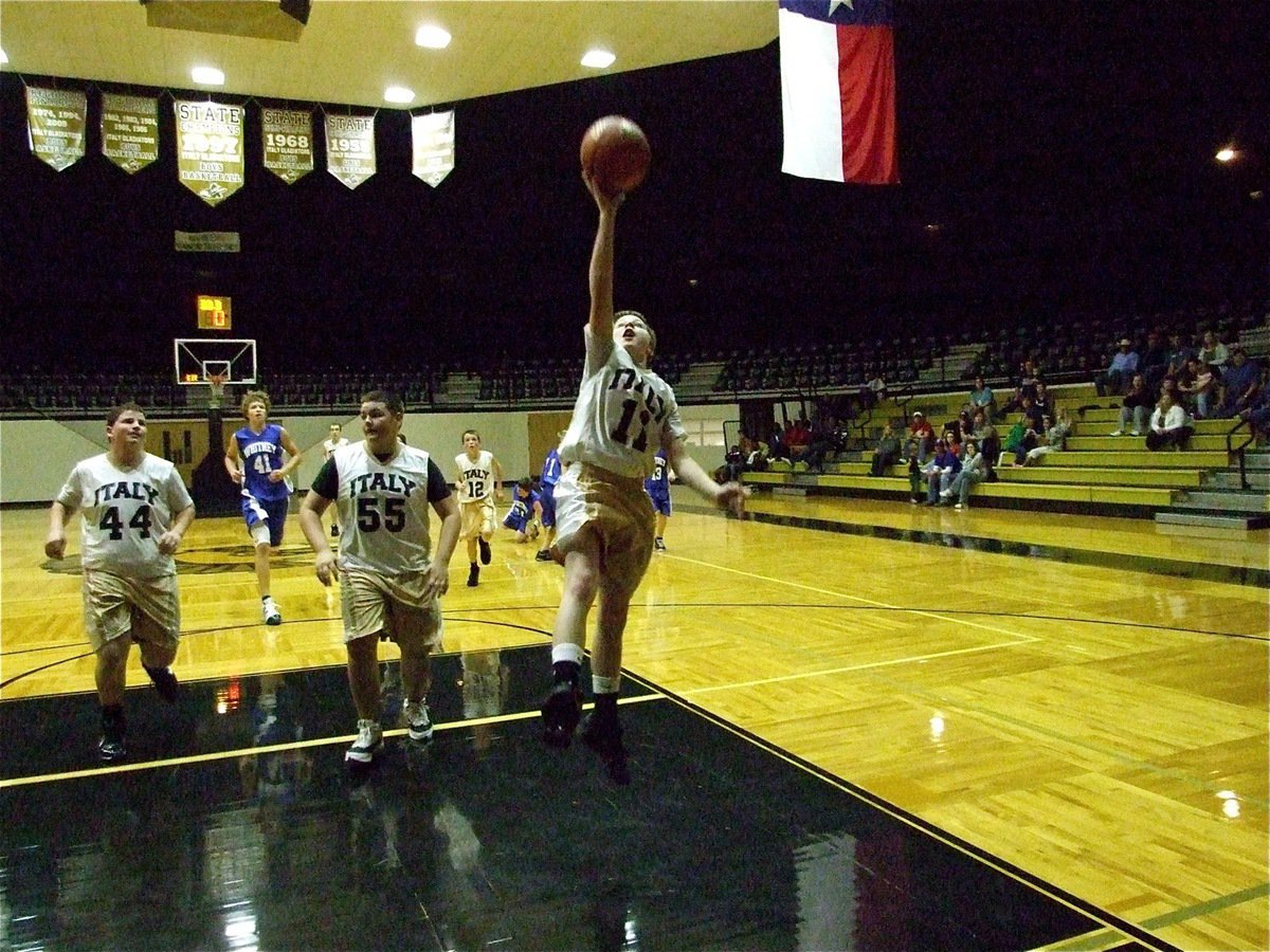 Image: Italy muscles their way to the rim but Whitney sneaks out with win — Italy’s John Byers(44) and Kelton Bales(55) forming a wall, John Escamilla(11) steals the ball at mid-court and reaches the basket before the Whitney Wildcats can chase him down. The Junior High Gladiators lead late but the Wildcats lead last to win 30-29.