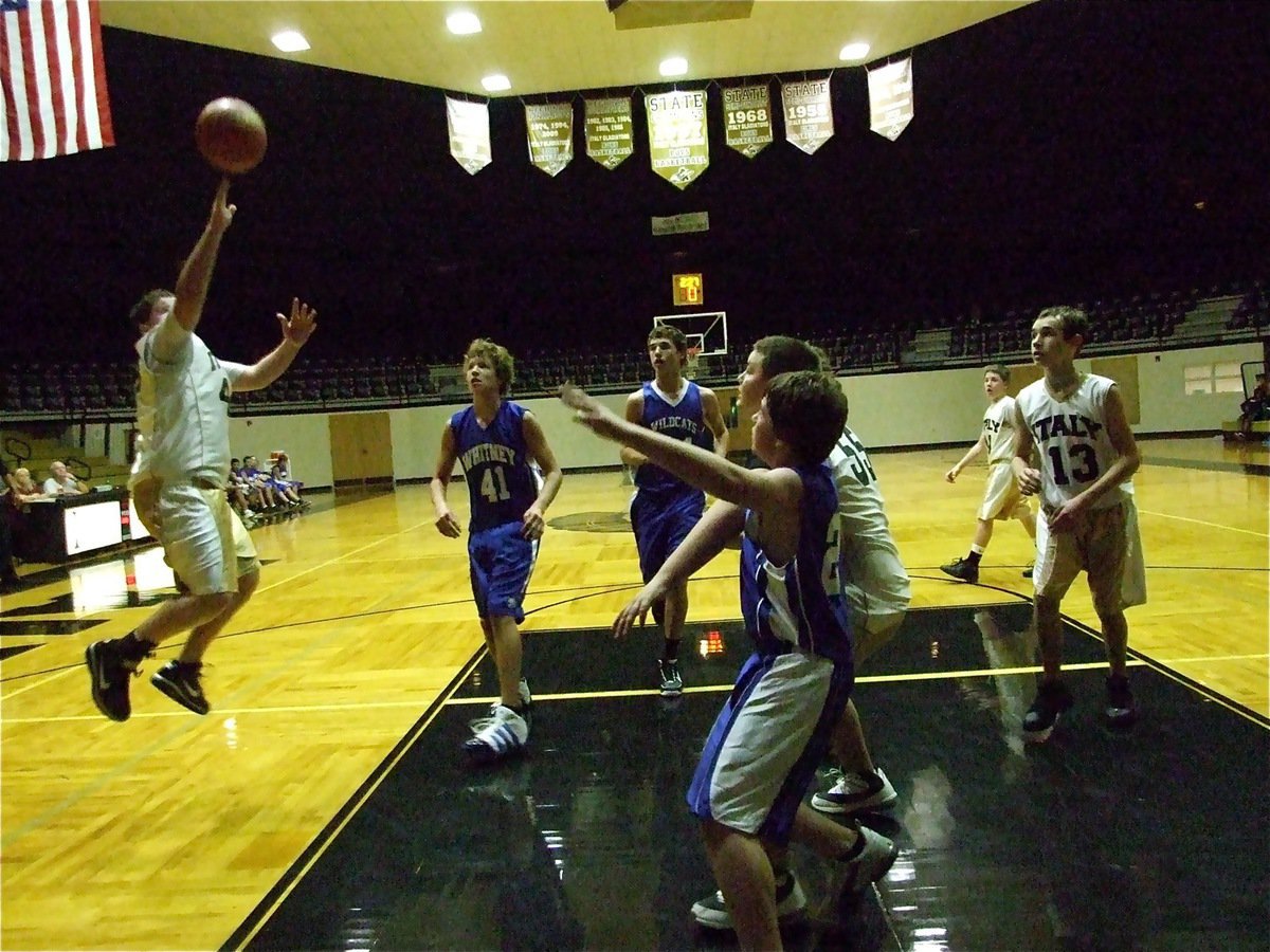 Image: A good look — Italy’s John Byers(44) pulls up for a jump shot during a wild finish with the Whitney Wildcats as teammates Kelton Bales(55) and Ryan Connor(13) move in for a rebound.