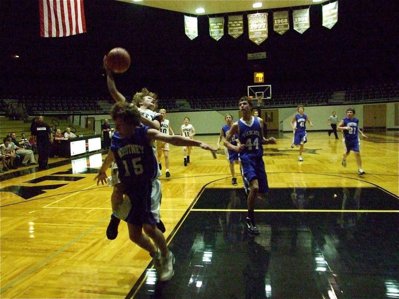 Image: Peck is hammered — Italy’s Lance Peck takes the hard foul and goes to the free-throw line against Whiney.