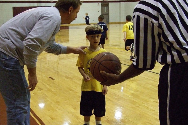 Image: Eyes on the ball — Italy Yellow (K-2nd) coach, Charles Hyles, reminds his son Chase Hyles to never, ever, take his eyes off the ball.