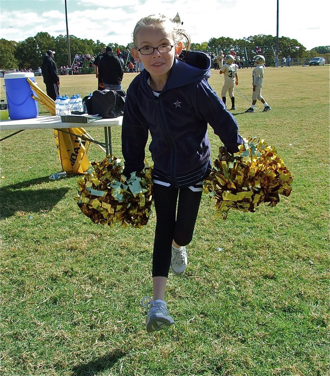 Image: Rise, Italy! — IYAA cheerleader Madelyn Chambers helps cheer on the B-Team Gladiators to a win over Palmer.