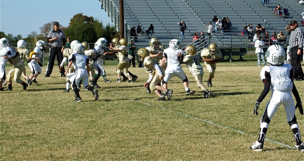 Image: Teamwork wins Championships — Blocking, ball faking and running hard helped the IYAA C-Team Gladiators (K-2nd) pull off an upset win over Scurry-Rosser.