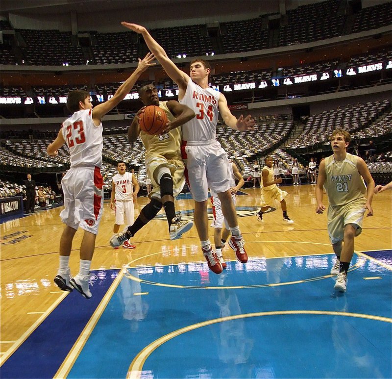 Image: Gladiators challenged Rams inside the American Airlines Center — Jasenio Anderson(11) splits two defenders on his way to the basket while Cole Hopkins(21) moves in for a possible rebound during a matchup between the Italy Gladiators and the Mineral Wells Rams inside the American Airlines Center in Dallas on Thursday.