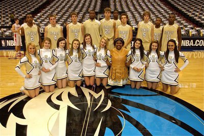 Image: Strength in numbers — The Italy Gladiators and the IHS cheerleaders pose around the Mavericks’ logo at center court following the game: Back row Heath Clemons, Ryan Ashcraft, Jase Holden, Larry Mayberry, Jr., Cole Hopkins, Devonta Simmons, Brandon Souder, Colton Campbell, De’Andre Sephus and Jasenio Anderson. Front row Mary Tate, Taylor Turner, Meagan Hooker, Casandra Jeffords, Kaitlyn Rossa, Sierra Harris, Sa’Kendra Norwood, Beverly Barnhart, Morgan Cockerham and Anna Viers.