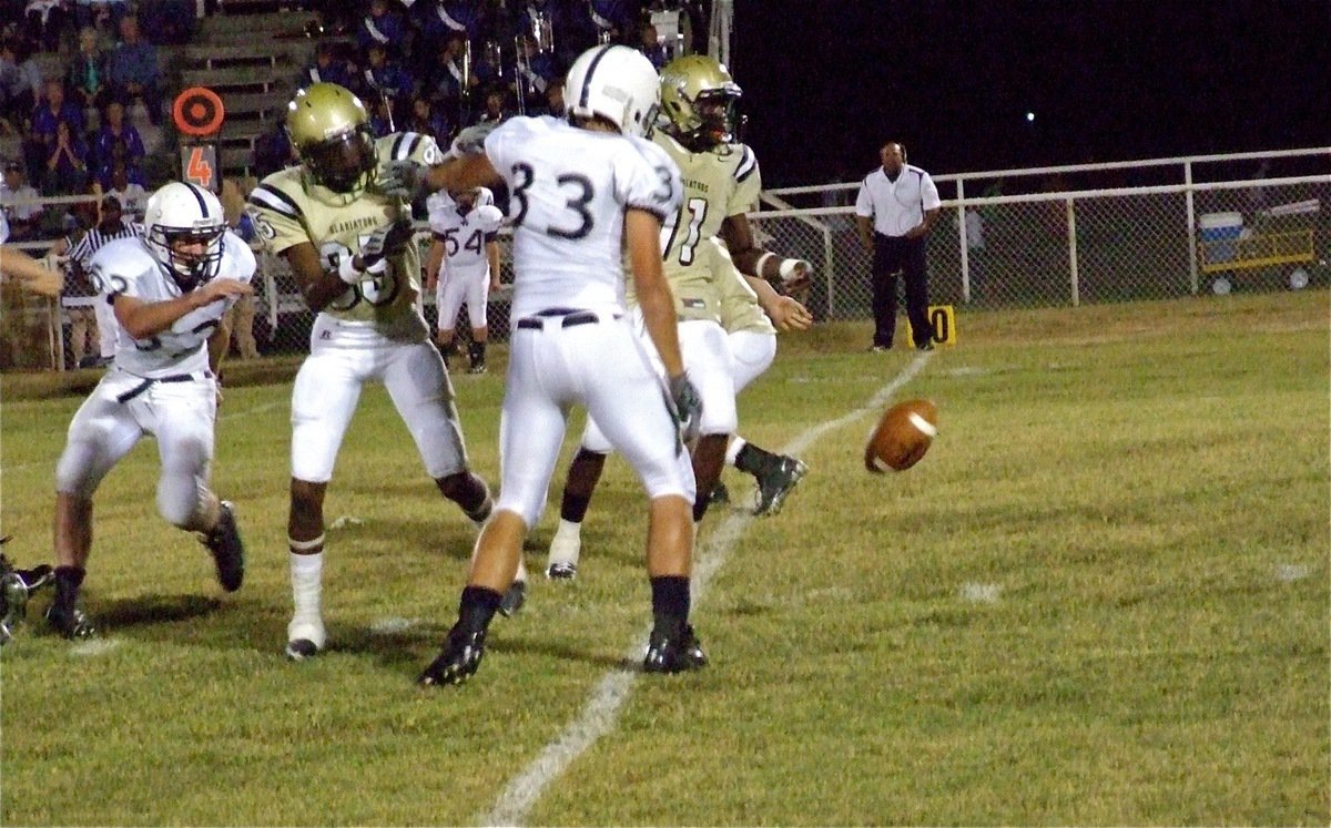 Image: Punt blocked — The Leon Cougars block a Jasenio Anderson(11) punt and Leon’s Drake Jones(33) recovers at the Gladiator 30-yard line.