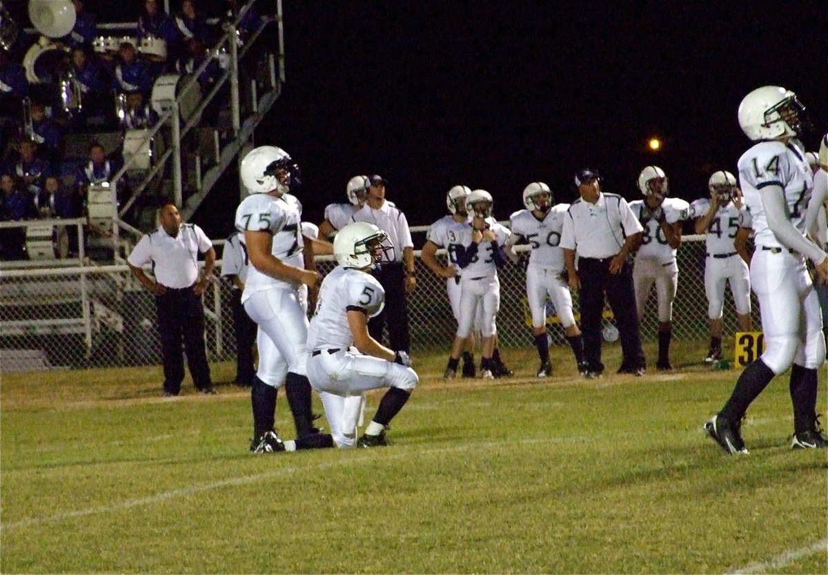 Image: Leon has a chance — Cougar kicker Garrett Robertson(75), holder Kyle Bumpurs(5) and Juan Hernandez(14) watch Robertson’s 29-yard field goal attempt clear the bottom bar of the uprights to give the Cougars a 10-0 advantage to start the game.