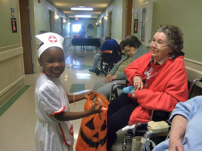 Image: Happy Little Nurse — This little “nurse” is having a lot of fun.