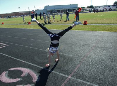 Image: Ama-za-zing! — IYAA Minors Cheerleader, Courtney Riddle, completes a summersault during the B-Team game.