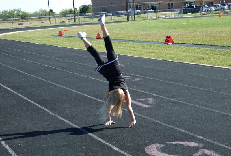 Image: Awesome flip! — Backflipping after her B-Team’s 36-0 victory over Mildred is IYAA Minors Cheerleader Lacy Mott.