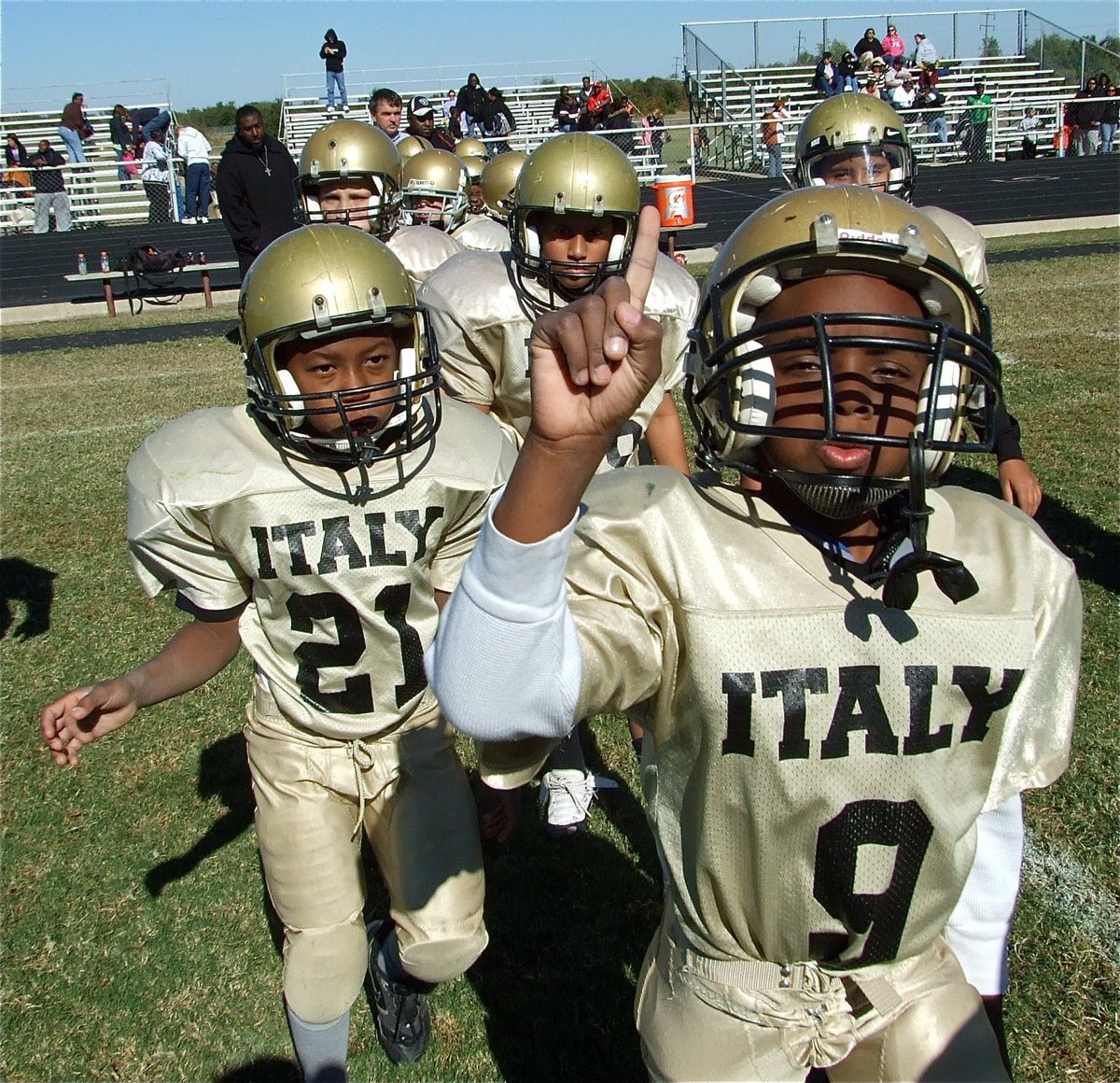 Image: Definitely #1! — B-Team players begin the celebration after earning their 7th straight win to finish the 2010 regular season as undefeated division champions. Addison, Burley, Hayes, Wiser, Itson and their teammates trot out to congratulate Mildred on a hard fought game.