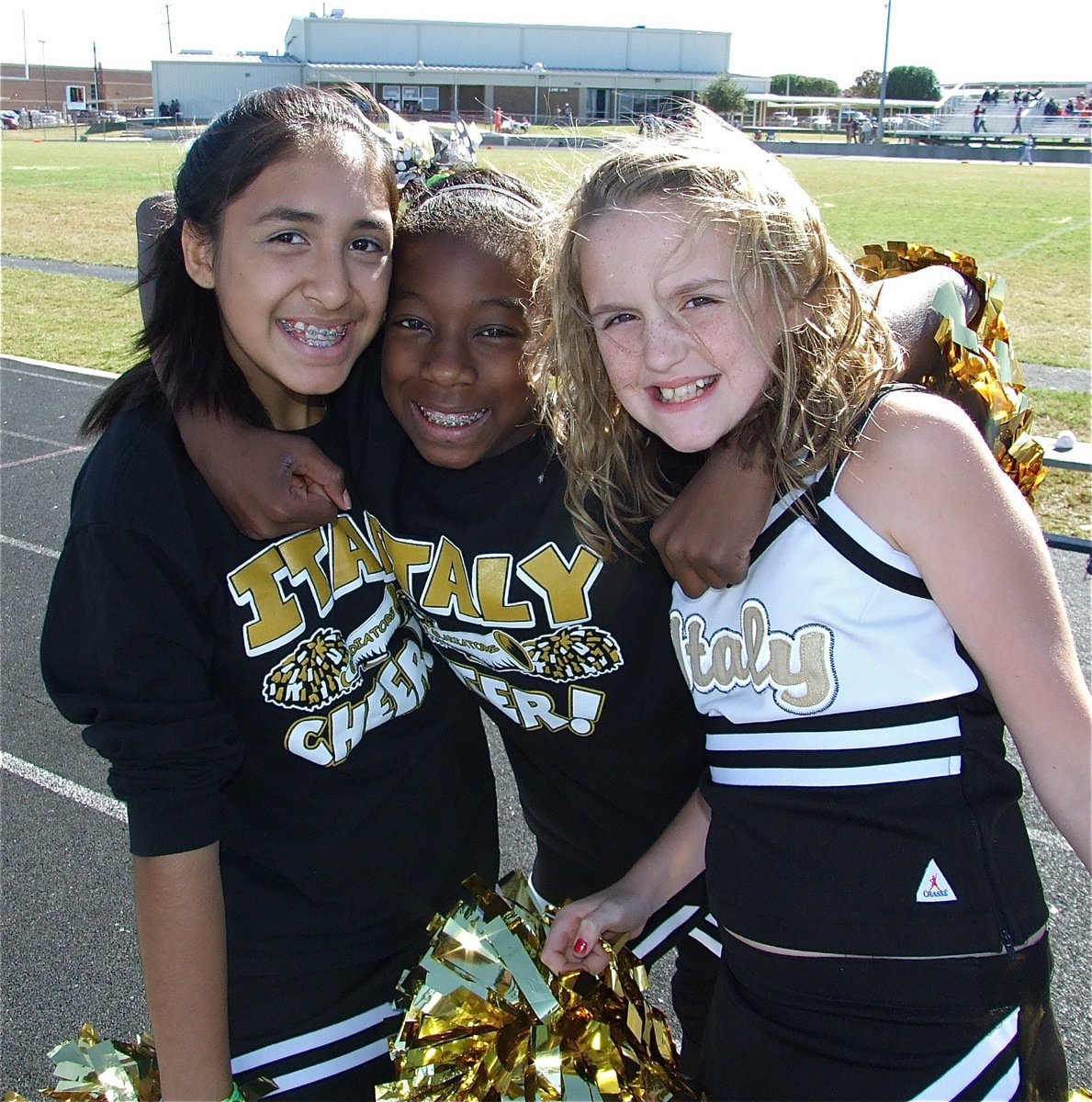 Image: So excited! — IYAA Major cheerleaders Elizabeth Garcia, Taylor Henry and Kirby Nelson hold on for luck.