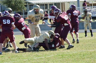 Image: Fast tackle — Kenneth Norwood(25) blasts thru the Mildred offensive line and quickly sacks Mildred’s quarterback.