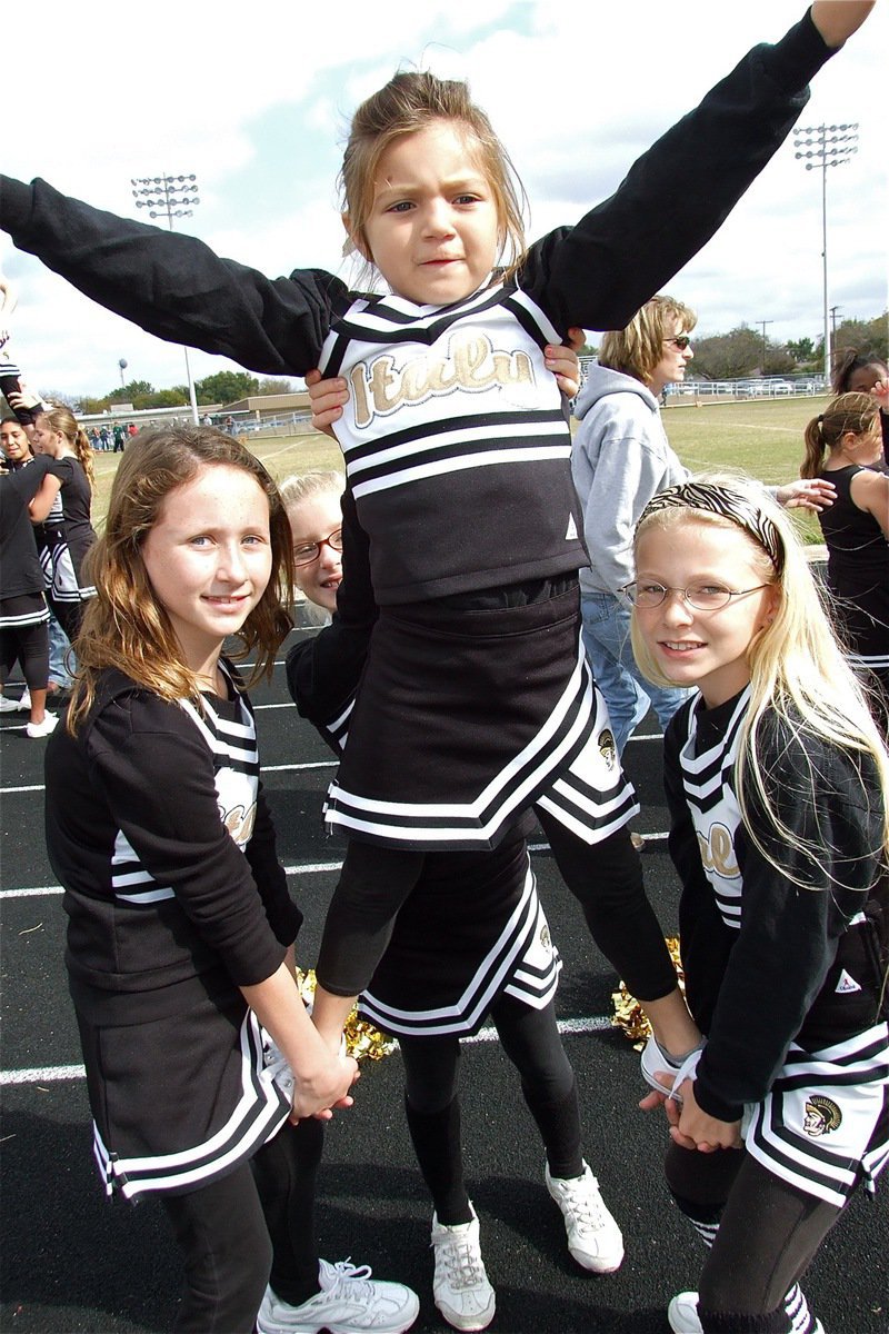 Image: The right moves — IYAA Cheerleaders build pyramids to help elevate the intensity on the field.