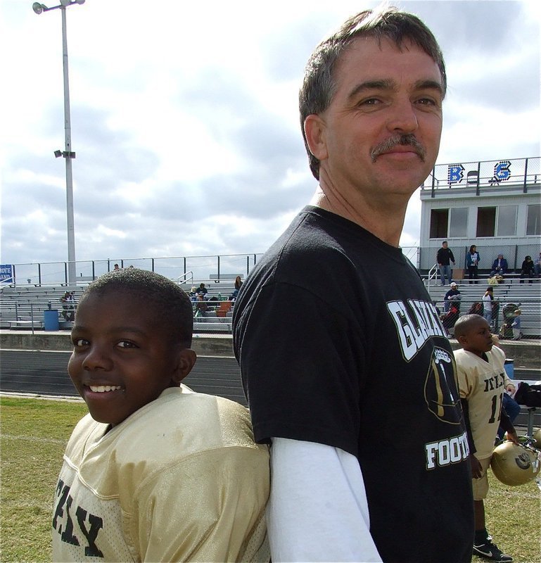 Image: Back-to-back Champs! — B-Team quarterback and IYAAs Co-MVP of the 2010 NESA B-Division Superbowl, Taron Smith, stands alongside his head coach, Gary Wood, after the twosome teamed up for back-to-back Superbowl Championships.