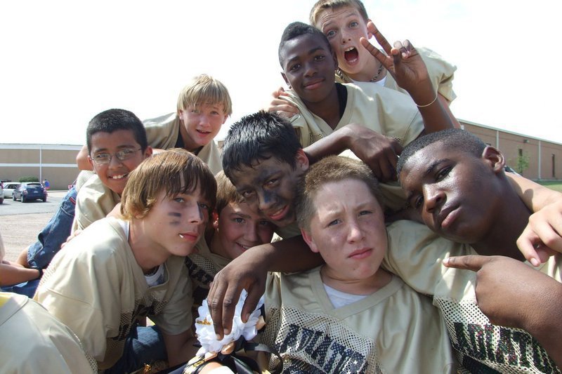 Image: Excitement in the air — Several players on the Italy Junior High football team mug for the camera before the Homecoming parade gets underway.