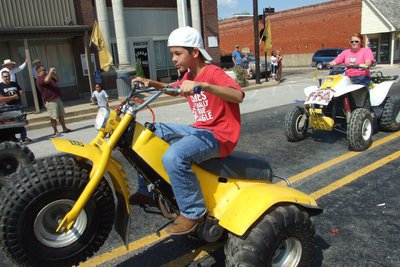 Image: How we roll — An army of 4-wheelers make their way down Main Street during Italy High School’s 2010 Homecoming Parade.