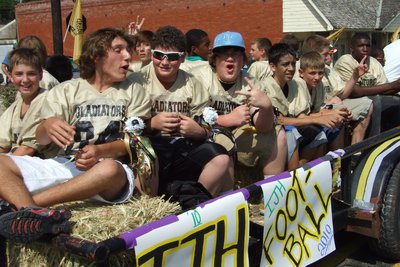 Image: Go IJH!! — Gladiator Football Players hoot and hollar during the Homecoming parade.