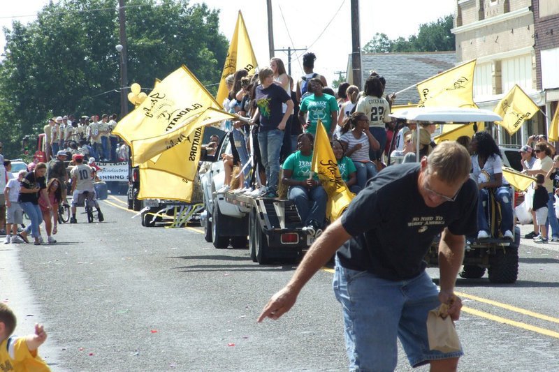 Image: The fun has just begun — Gladiator fans storm main street after Italy High School’s 2010 Homecoming Parade in search of candy and goodies.