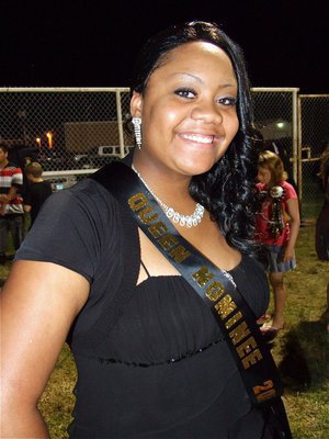 Image: Amber Mitchell — 2010 Homecoming Queen Nominee Amber Mitchell offers a smile before halftime.